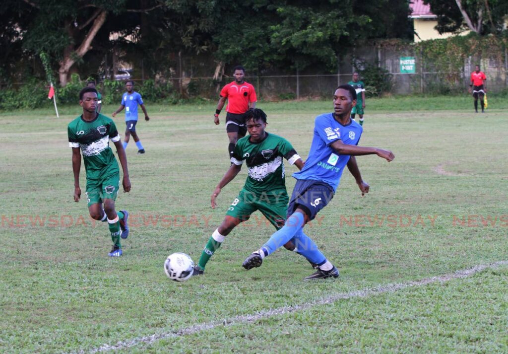 St. Augustine's Jordan Ferdinand, centre, and Naparima's Daimiel Mitchell go after the ball during the teams' Secondary Schools Football League (SSFL) Premier Division match at the St Augustine Secondary School Ground in St Augustine, on September 14. - AYANNA KINSALE