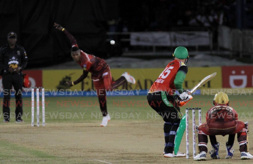 Trinbago Knight Riders left-arm spinner Akeal Hosein (second from left) bowls to Guyana Amazon Warriors' Heinrich Klaasen (second from right) during the teams' Hero Caribbean Premier League (CPL) match at the Queen's Park Oval, St Clair on Wednesday. - Ayanna Kinsale