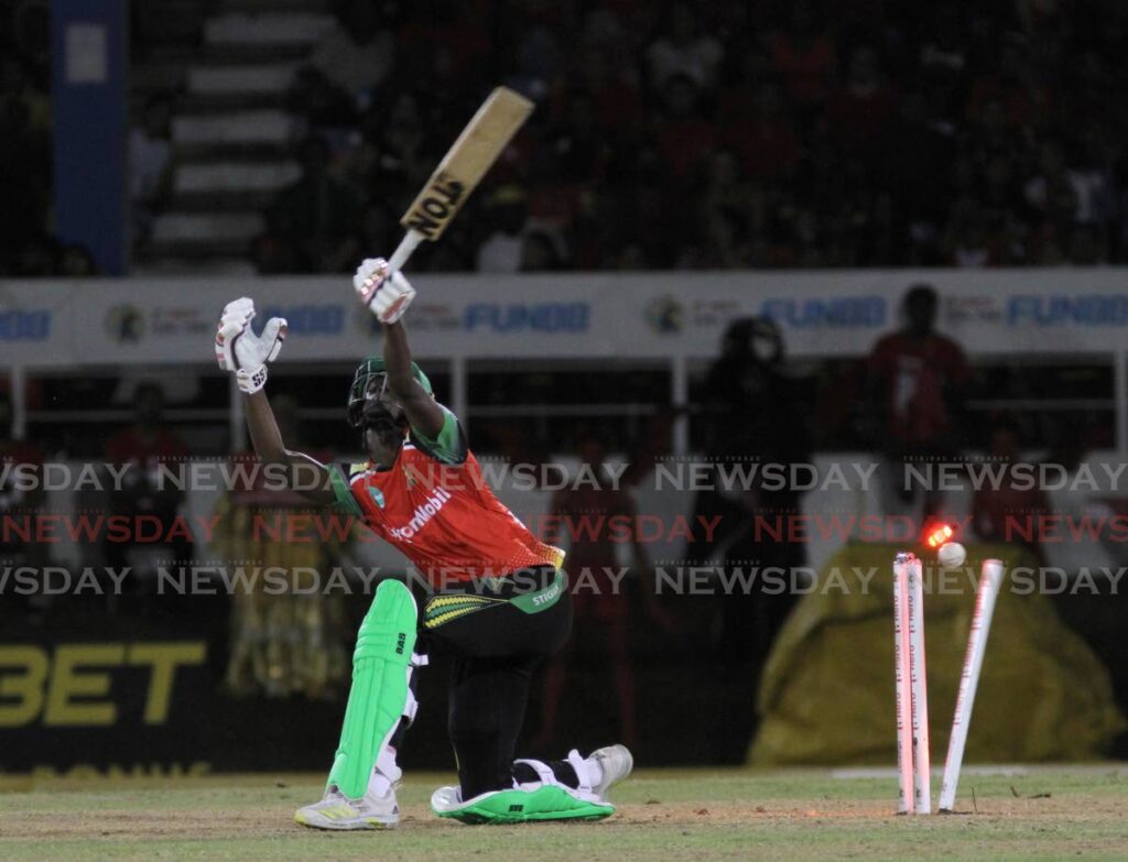 Guyana Amazon Warriors batsman Junior Sinclair is bowled by Trinbago Knight Riders pacer Andre Russell to end the teams' Hero Caribbean Premier League (CPL) match at the Queen's Park Oval, St Clair on Wednesday. Photo by Ayanna Kinsale