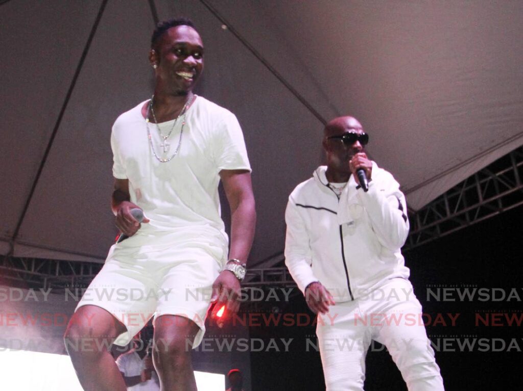 Dwayne Bravo, left, and Iwer perform Champion Bam Bam at Bravo's 47 Charity All White Event, at Queen's Hall Garden Theatre, St Ann's. Photo by Angelo Marcelle