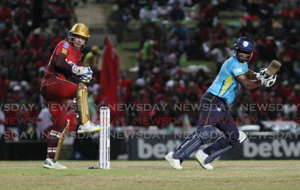 St Lucia Kings' Johnson Charles looks on after playing a shot against the Trinbago Knight Riders during the Hero CPl T20 match, on Sunday, at the Brian Lara Cricket Academy, Tarouba.  - Lincoln Holder