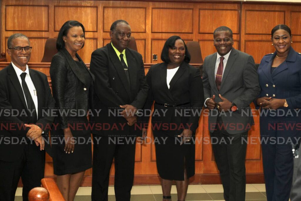 Industrial Court president Debra Thomas-Felix, centre, with vice-president Herbert Soverall, third from left, TT Police Service Social and Welfare Association president ASP Gideon Dickson, second from right, and other members of the police union at the opening of the Industrial Court's law term at the court in Port of Spain on Monday. - ROGER JACOB