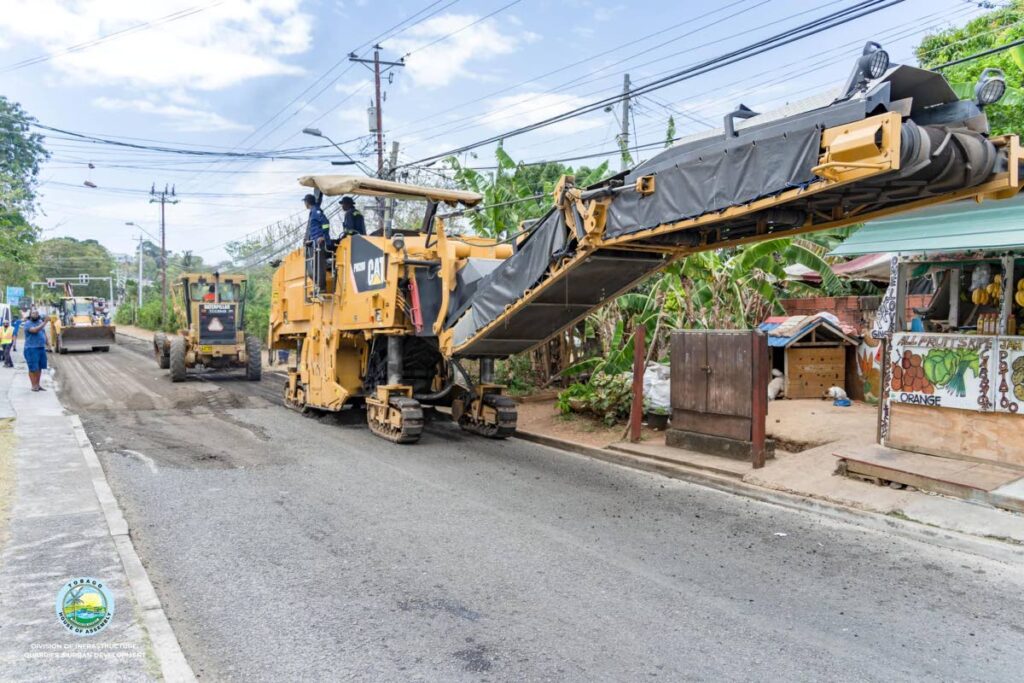 ROAD WORKS: Heavy machinery involved in road repairs by the THA Division of Infrastructure, Quarries and Urban Development earlier this year. PHOTO COURTESY THA  - 