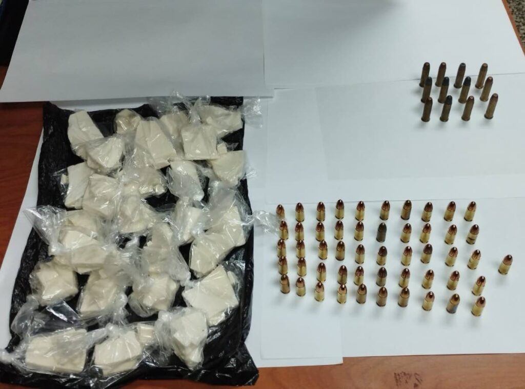 Cocaine and ammuniton seized by police during a raid in Carenage on Friday.  - Photo courtesy TTPS