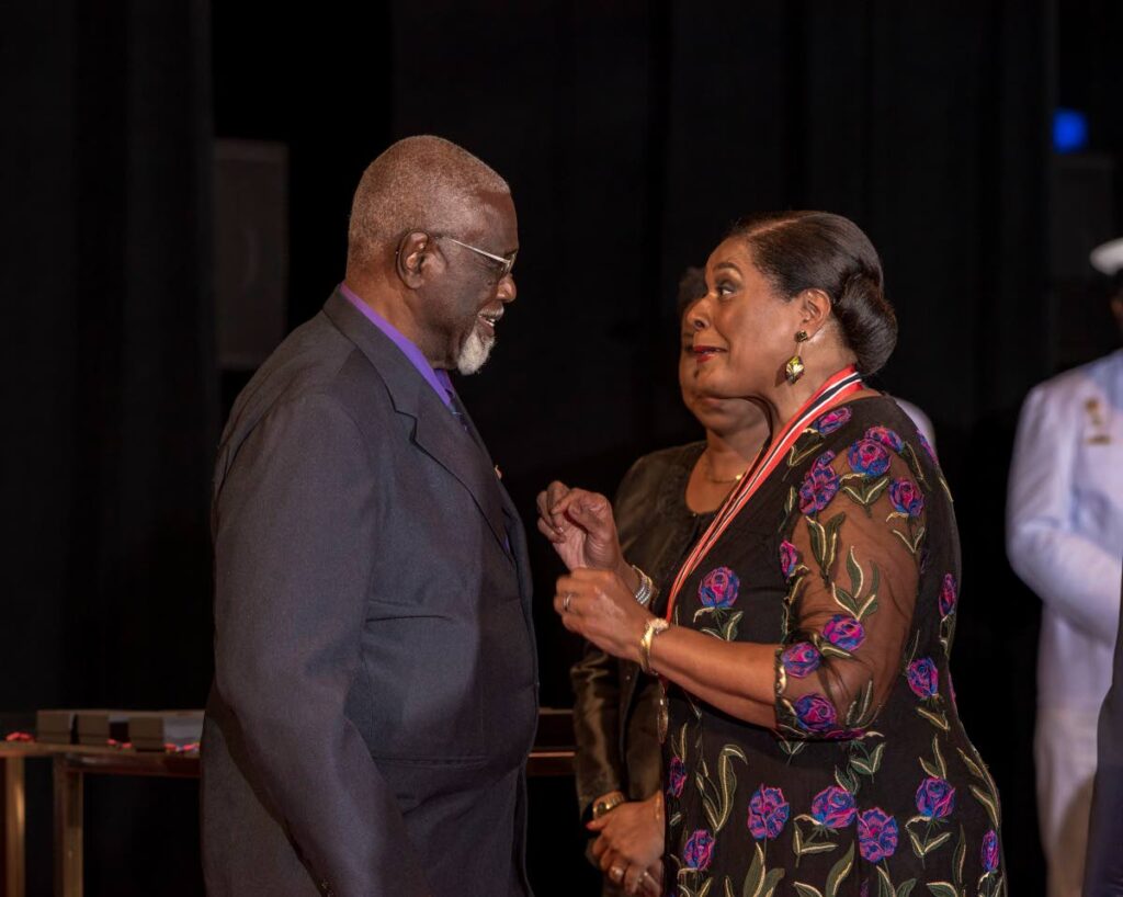 Prof Emeritus Gordon Rohlehr and President Paula-Mae chat after he received the Chaconia silver medal at the National Awards ceremony, NAPA, Port of Spain. Photo courtesy Office of the President. - 
