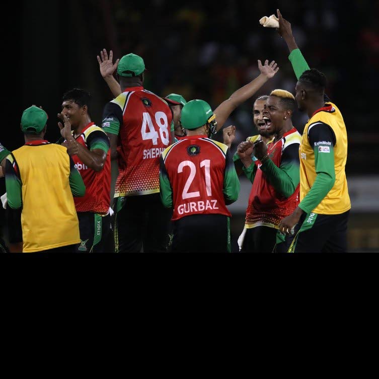 Guyana Amazon Warriors players celebrate after beating the Trinbago Knight Riders, on Saturday, by 37 runs during the Hero Caribbean Premier League Twenty20 match, at Providence Stadium in East Bank Demerara, Guyana. - CPL T20