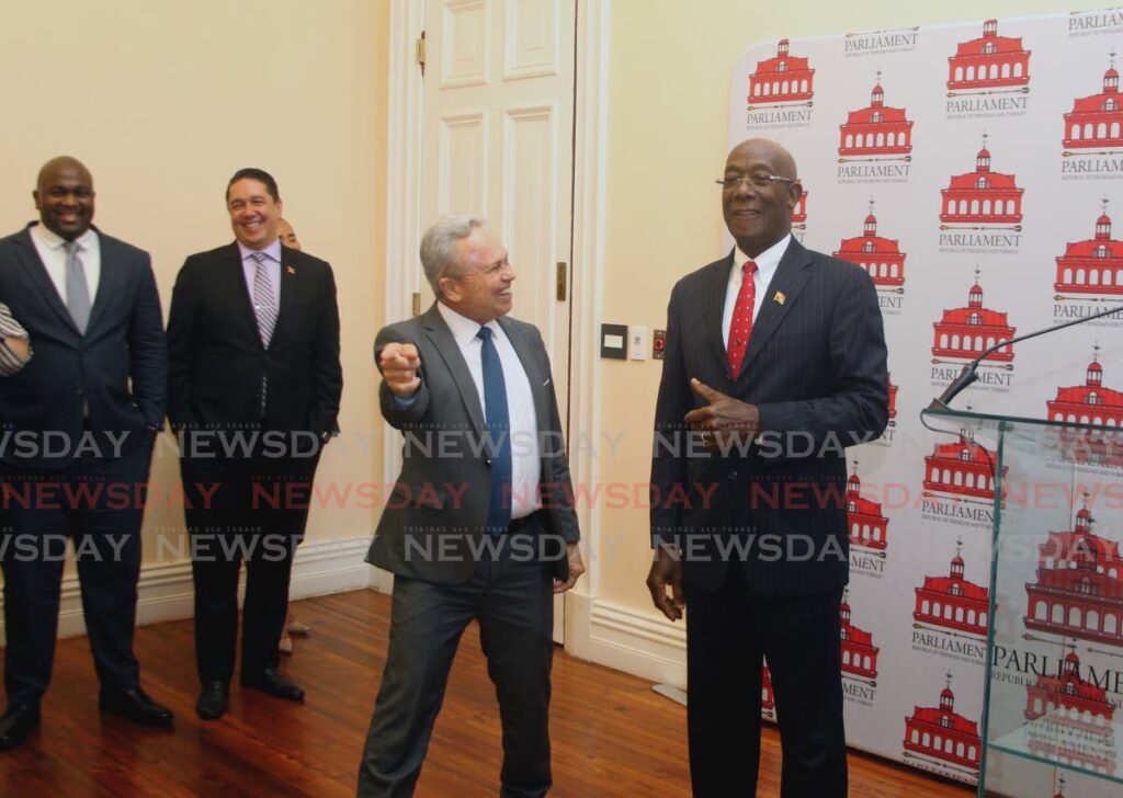 POST BUDGET JOKE: Finance Minister Colm Imbert jokes with Prime Minister Dr Keith Rowley in the Red House moments after Imbert delivered his budget speech. PHOTO BY ROGER JACOB - 