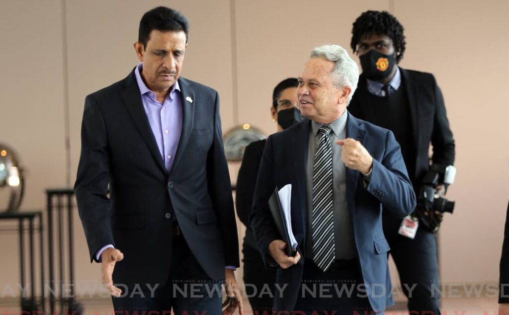 BUSINESS CHAT: Amjad Ali, managing director of Advance Foam Ltd chats with Finance Minister Colm Imbert as they make their way to the TTMA’s post budget forum at the Hyatt Regency in Port of Spain on Tuesday. PHOTO BY SUREASH CHOLAI - 