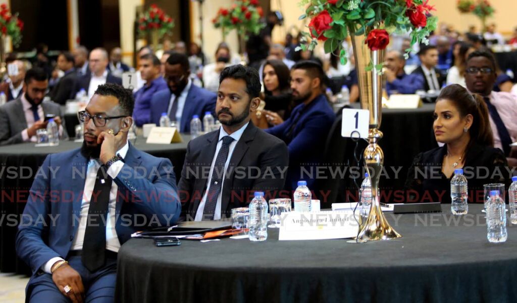 LISTENING TO COLM: Principal Medical Officer Dr Maryam Abdool-Richards, right, who is also a director in Angostura, listens to Finance Minister Colm Imbert at the TTMA's post budget forum on Tuesday at the Hyatt Regency in Port of Spain. PHOTO BY SUREASH CHOLAI - SUREASH CHOLAI