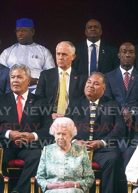 ROWLEY AND ROYALTY: Prime Minister Dr Keith Rowley is seen at the far right in this photo showing Queen Elizabeth II during the formal opening yesterday of the Commonwealth Heads of Government Meeting at Buckingham Palace. AP PHOTO  - 