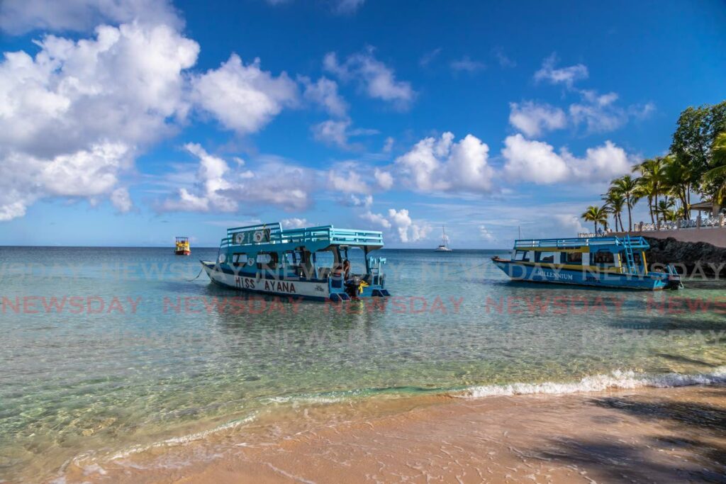 Glass bottom boats for tours of the reefs in Buccoo. Photo by Jeff K Mayers