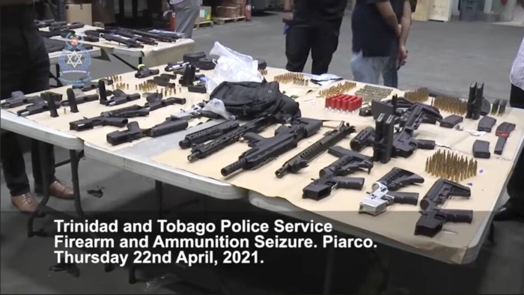 A screenshot of a police video showing some of the weapons seized at a Piarco bond in April last year. 