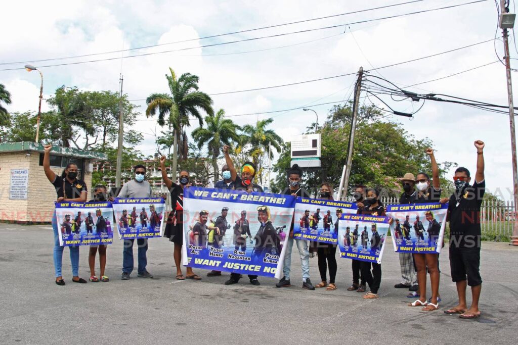Relatives and friends protest at Paria Fuel Trading Co Ltd, Pointe-a-Pierre, on May 7, over the deaths of four divers during maintenance on an underwater pipeline in February. - Photo Marvin Hamilton