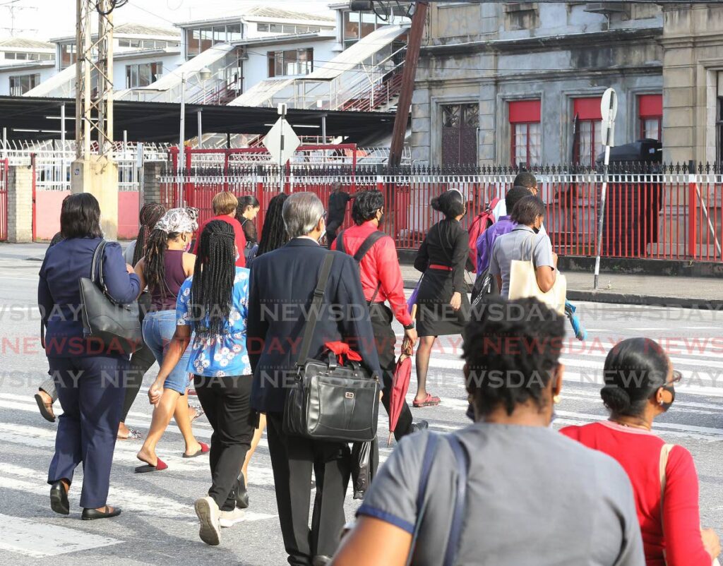 Commuters head to City Gate for transport, many of them after work, in Port of Spain. Economist Roger Hosein raising the retirement age to 65 means senior employees can contribute to the economy at a higher level. - FILE PHOTO/ROGER JACOB
