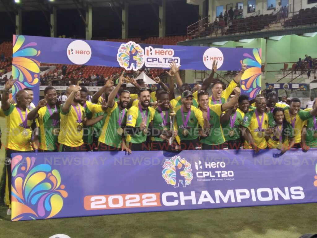 Players and officials of the Jamaica Tallawahs celebrate after the prize-giving ceremony, following their team's eight-wicket win over the Barbados Royals in the final of the Hero Caribbean Premier League at the Providence Stadium, Guyana on Friday. - Stephon Nicholas