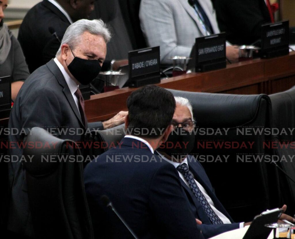 Health Minister Terrence Deyalsingh, from right, Finance Minister Colm Imbert and Local Government Minister Faris Al-Rawi during the budget debate on Saturday. - ROGER JACOB