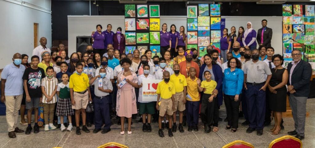 Participants in the Republic Bank and RapidFire Kidz Foundation Art Awards with relatives and representatives of the foundation and the bank  at the prize-giving ceremony at Naparima College auditorium, San Fernando. - 