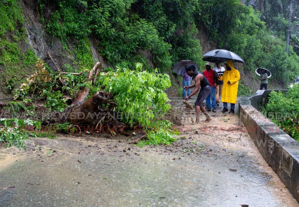LANDSLIDE WEATHER: A section of this road in Bad Hill, Tobago was blocked by debris from a landslide caused by heavy rainfall on Wednesday. PHOTO BY DAVID REID  - 