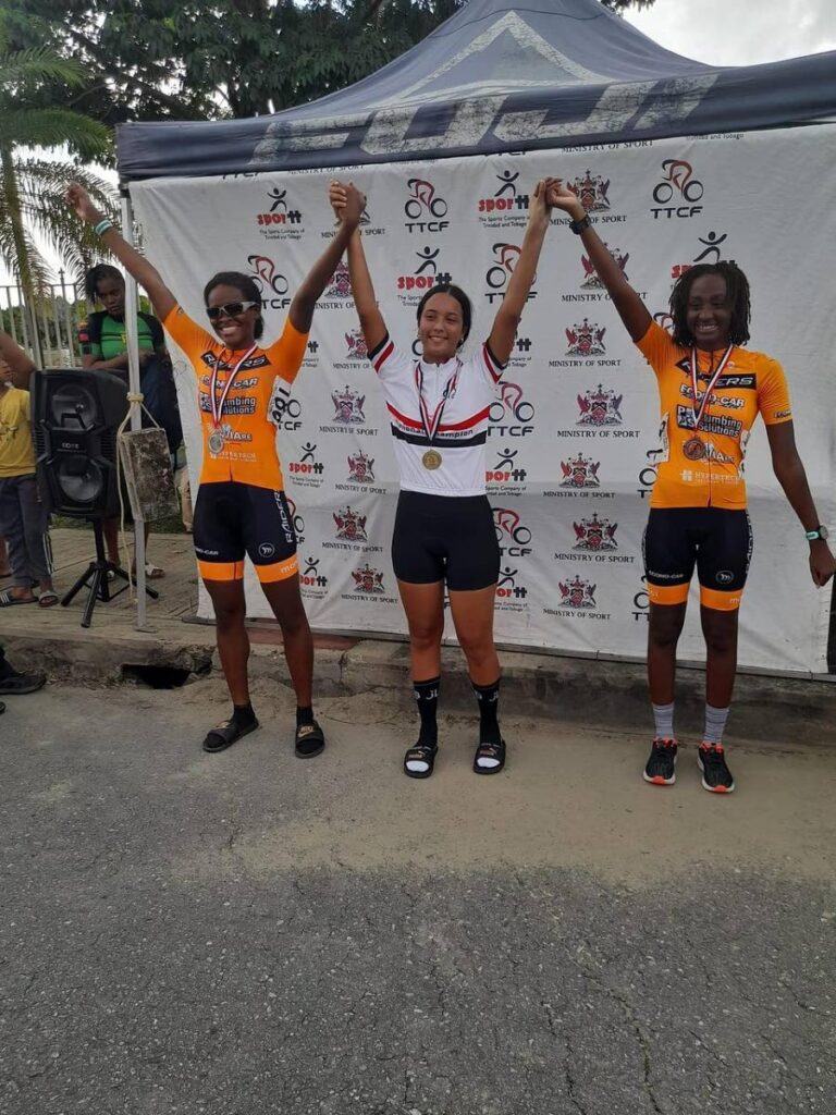 JLD Cycling Academy's Makaira Wallace, centre, celebrates the capture of the national juvenile criterium title recently. - 