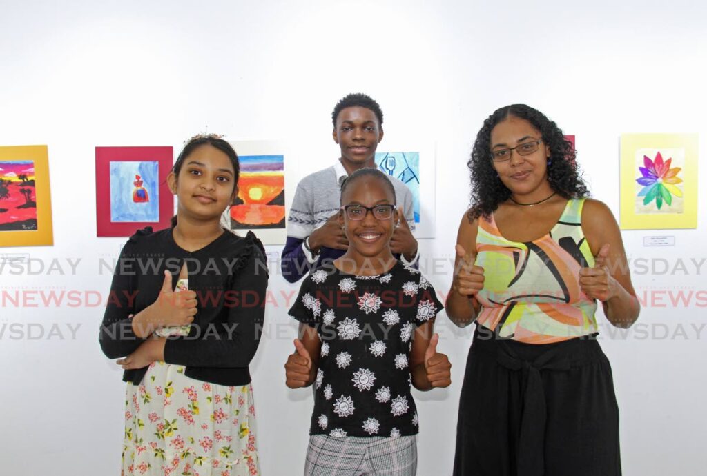 Malissa Diaz and artists Kenya Jacque, Vaishnavi John and Jared Cambridge, whose work are on show at the Oodles of Art Doodles exhibition at Arnim's Galleria, La Romaine. - Marvin Hamilton