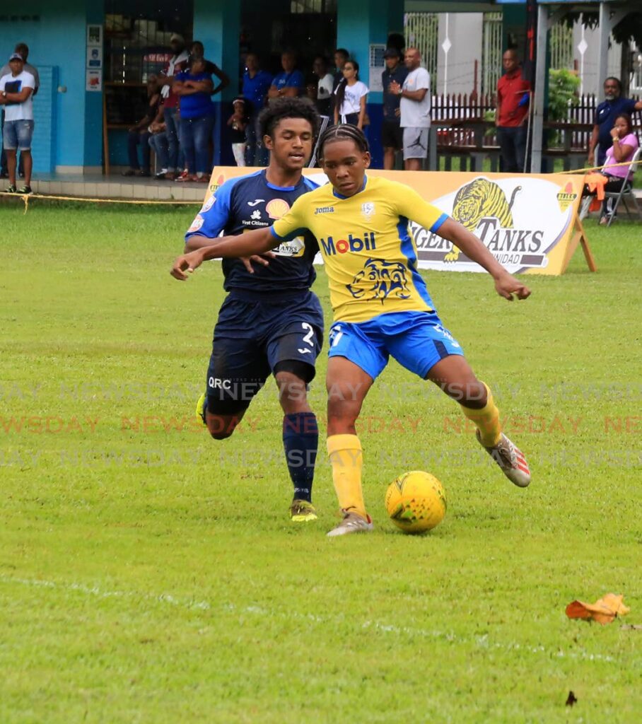 Presentation College San Fernando's Isaiah Jacob (R) controls the ball against Queen's Royal College's Malic Harraman during the SSFL Premier Division match, on Saturday, at the Queen's Royal College grounds, Port of Spain. - SUREASH CHOLAI