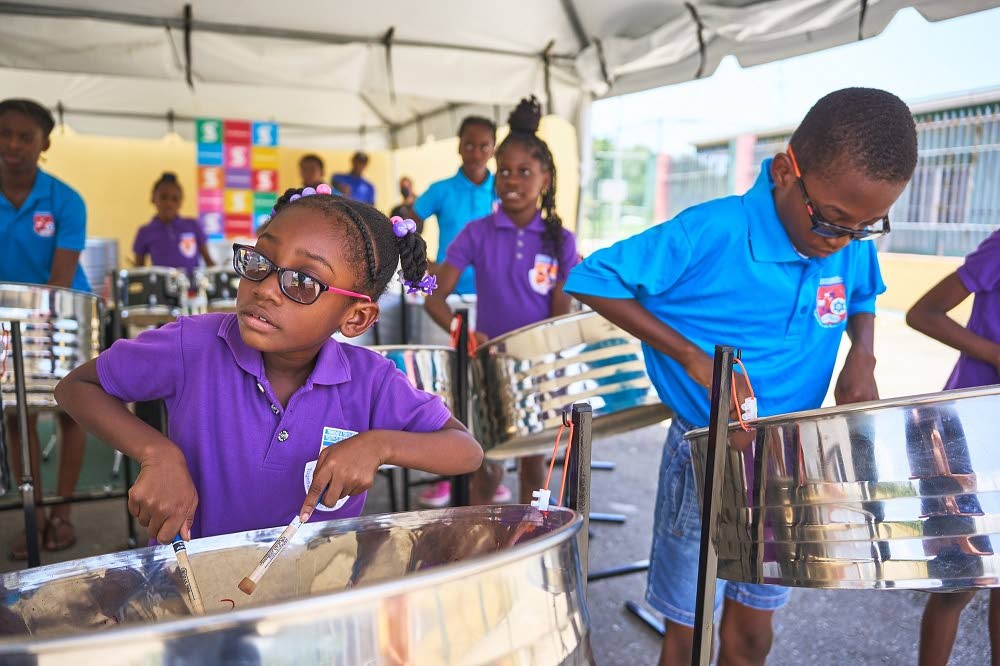 PRACTISE MAKES PERFECT: Young members of the Beetham Vibrations Steel Orchestra go through their paces on the pans during a recent practise session. Photo courtesy The Rotary Club of Central Port of Spain