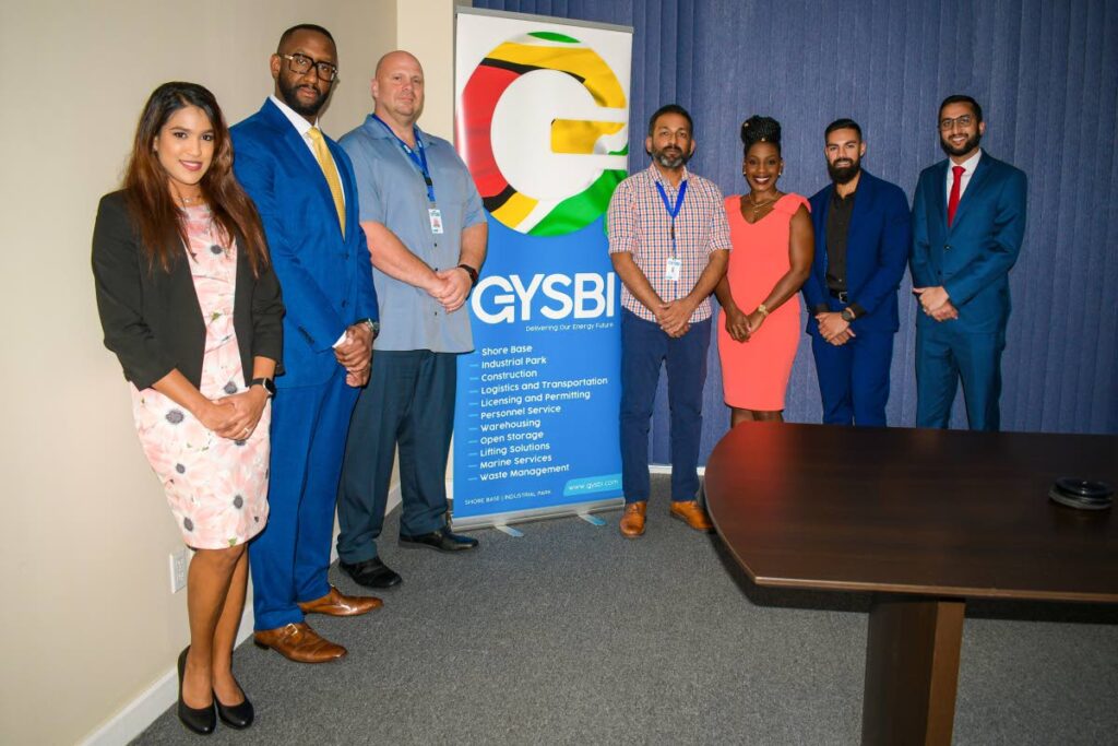 Marli Creese, head of corporate and investment banking, NCB Merchant Bank (TT) Ltd, second from left, and Robert Albiez, third from left, general manager Guyana Shorebase Inc, third from left, and team members of both companies after the signing of a loan facility. - 