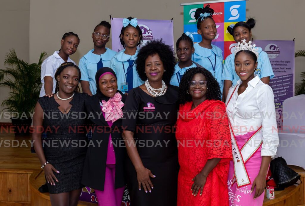 From right, Miss Universe TT 2022 Tya Jane Ramey, head of Chancery, Nigeria High Commission, Esther Golo, CEO of Women of Substance Onika Mars, Beauty for Ashes’ Marva John Logan, Ryu Dan Dojo and Youth Empowerment’s Heidi Eastman, along with Speyside High School students attend a Women of Substance forum. on Tuesday, at the Bon Accord Canaan Multi-Purpose Facility, to mark International Day of the Girl Child. - David Reid