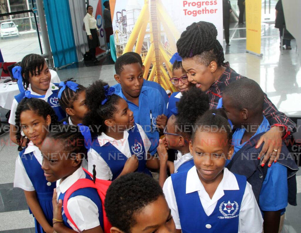 Minister of Education Dr Nyan Gadsby-Dolly chats with students of the Morvant Anglican School, at the Literacy Day Extravaganza, at NAPA, Port of Spain on Wednesday - ANGELO MARCELLE