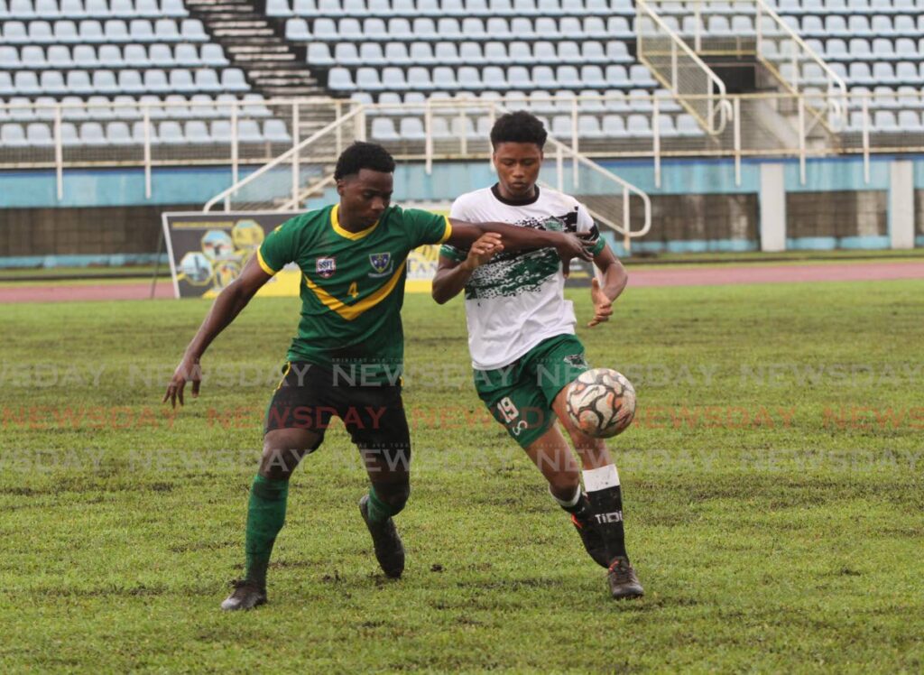 St Benedict’s Keanu Morean (L) and St Augustine Secondary School’s Marcel Valentine vie for the ball during the Secondary Schools Football League match, on October 12, at the Ato Boldon Stadium. Photo by Ayanna Kinsale