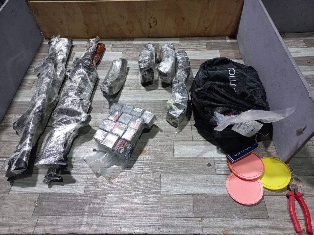Some of the 16 guns, ammuniation and marijuana seized by police in the Central Trinidad on Friday night. Photo courtesy TTPS - 