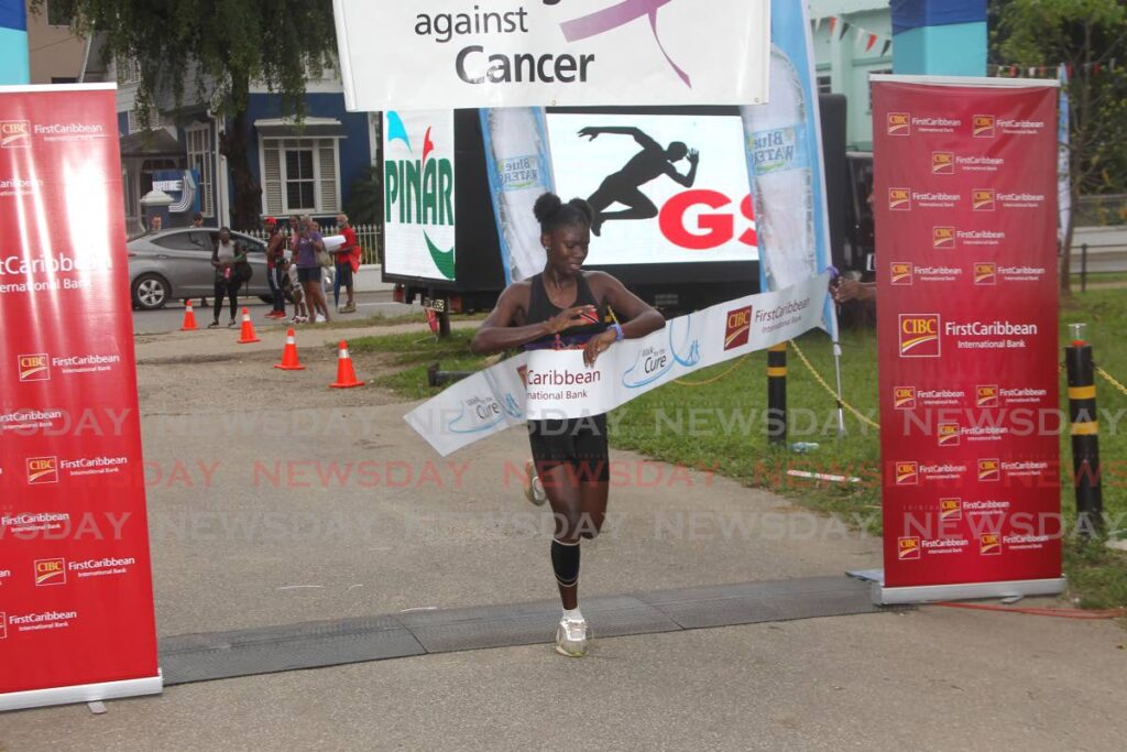 Aniqah Bailey was the first female to cross the finish line, in the  CIBC First Caribbean Run for the Cure 5k walk/run, at the Queen's Park Savannah, Port of Spain on Saturday. - ANGELO MARCELLE