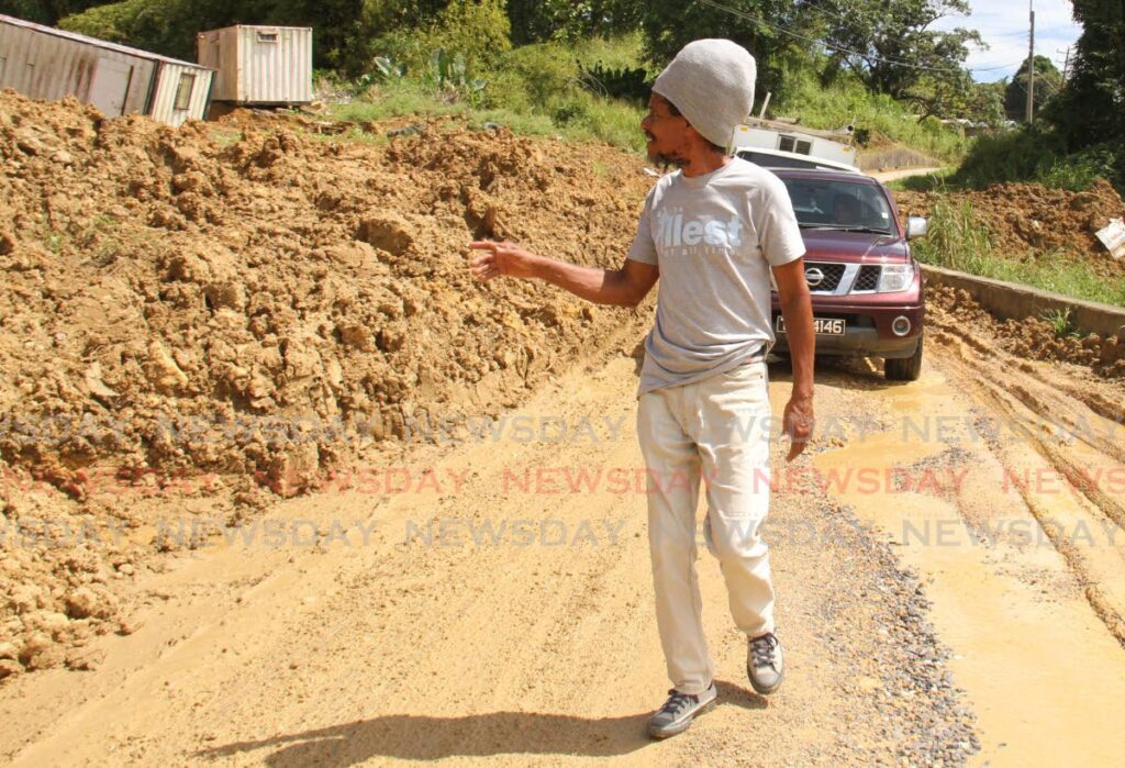 On Monday, Tabaquite resident Johnny Donaldson spoke to Newsday about a mudslide threatening to isolate residents in the area. Photo by Marvin Hamilton