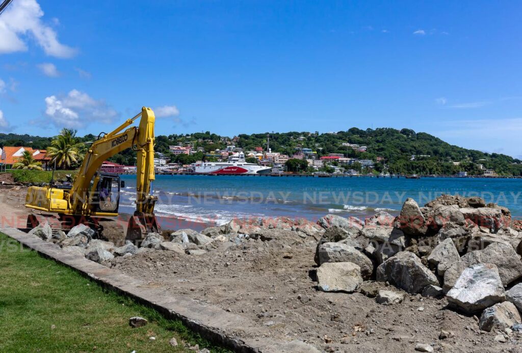 An excavator working along the coast at Rockly Bay, Tobago where the THA is building a stage in the sea. Photo by David Reid
