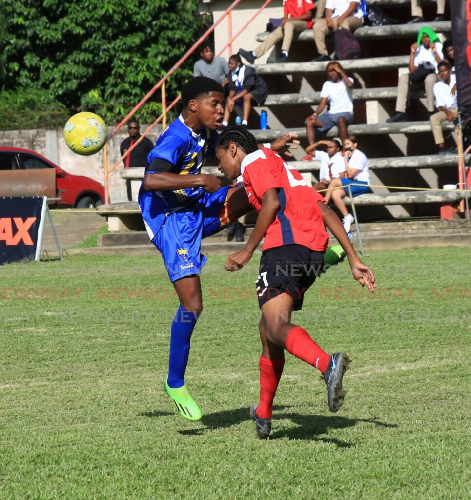 Fatima College’s Darius Jordan(L) and St Anthony’s College player Rueben Brusco vie for the ball during the Secondary Schools Football League Premiership preliminary round match, at the St Anthony’s Grounds, Westmoorings, on Tuesday. Photo by Sureash Cholai