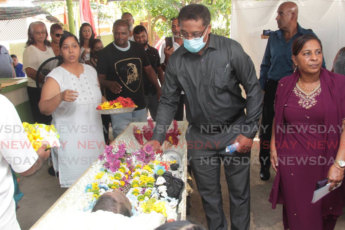 Former Newsday editor, Horace Monsegue pay his respect to  former Newsday chief photographer Rattan Jadoo  at his funeral at Dow Village California
