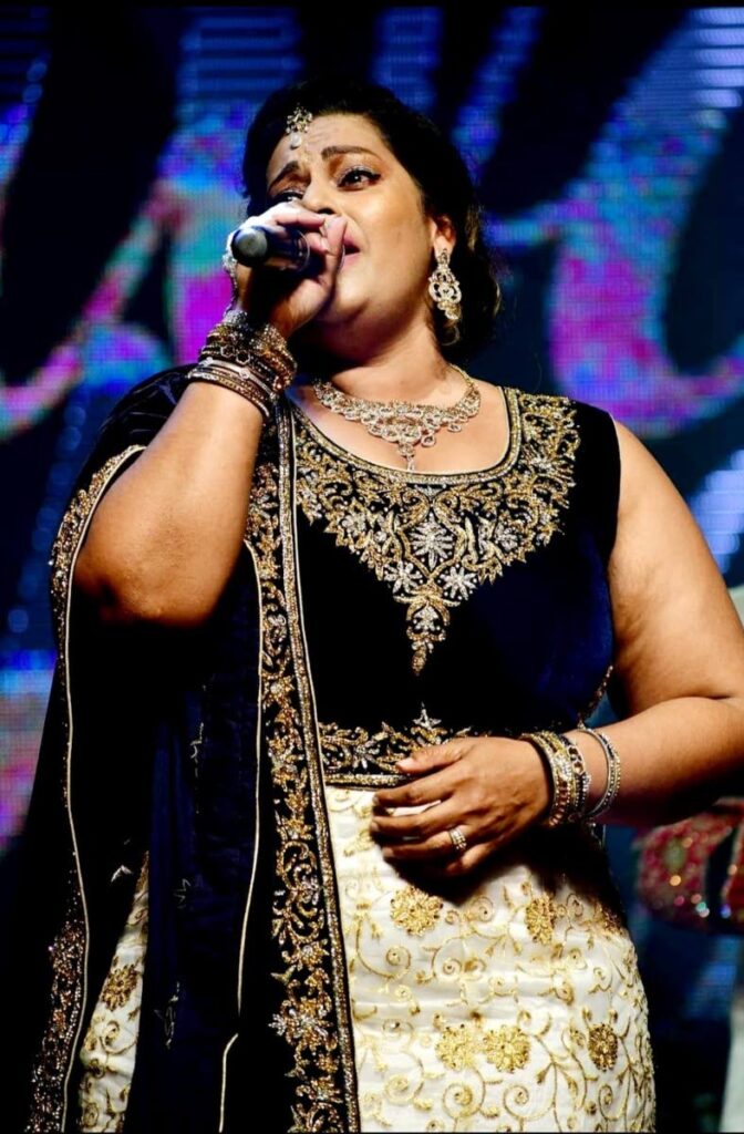 Rawytee Ramroop leader singer of Modern Electrical Rhythms during her performance  at the Divali Nagar in Chaguanas on Thursday.  - Photo courtesy NCIC