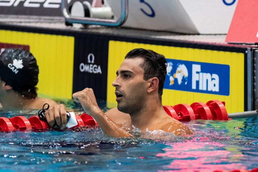 Dylan Carter of Trinidad and Tobago wins the men's 50m backstroke during the swimming world cup at Berlin. (AP PHOTO) 