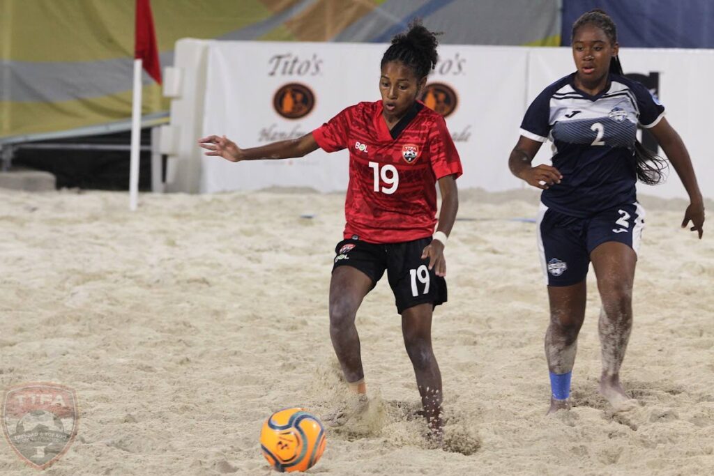 TT's Alexcia Ali (L) dribbles the ball during the Bahamas Beach Soccer Cup 2022 match against Turks and Caicos, on Friday, in Nassau, Bahamas.  - TTFA Media