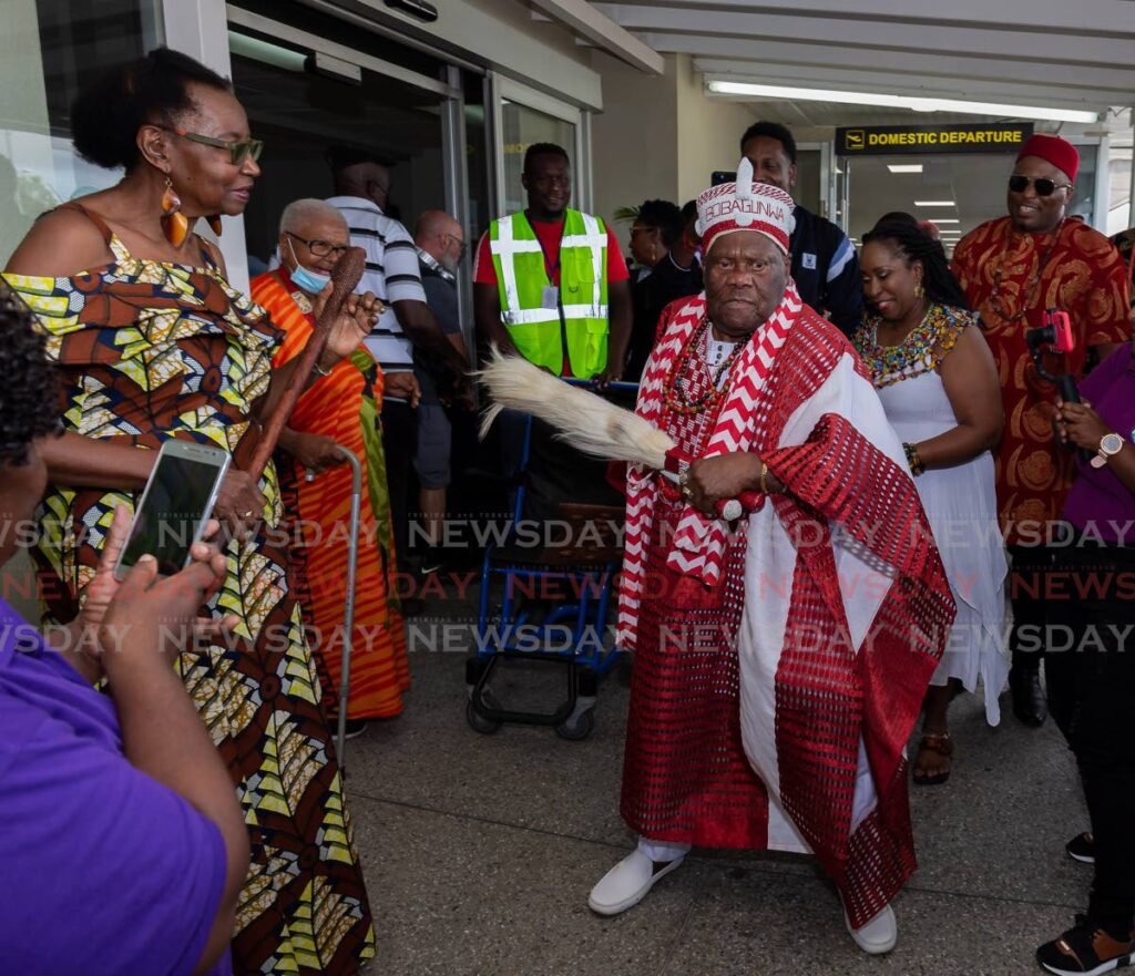 TT calypso icon Robert Alphonso Nelson, also known as Lord Nelson, dances for his fans on Sunday upon his arrival for the TOMAC Festival, at the ANR Robinson International Airport, Crown Point. - Photo by David Reid