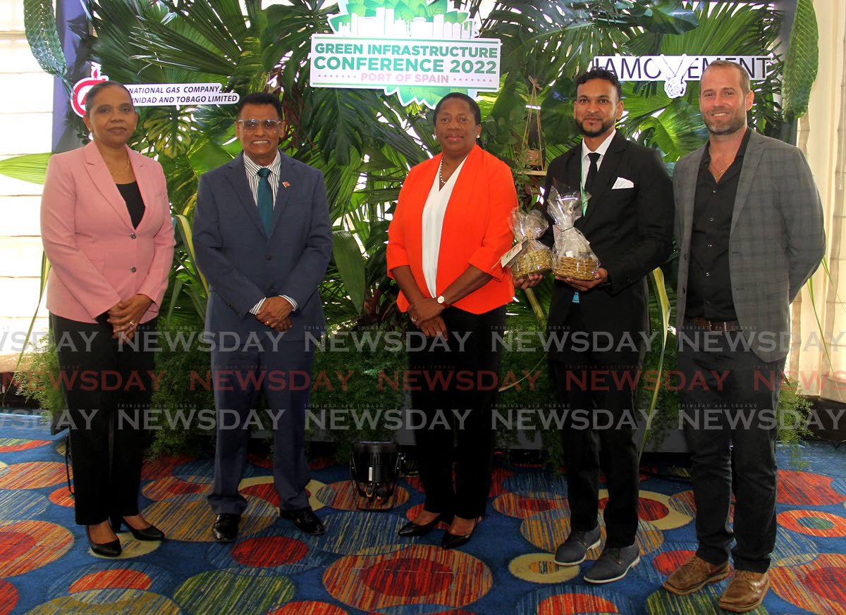 From left, Ministry of Works and Transport permanent Secretary Sonia Francis-Yearwood, Minister of Works and Transport rohan Sinanan, Minister of Planning and Development Pennelope Beckles-Robinson, managing director of the IAMovement, and Jonathan barcant pose for a  photo at the IAMovement Green Infrastructure Conference at Hilton, Port of Spain. 2022.10.25