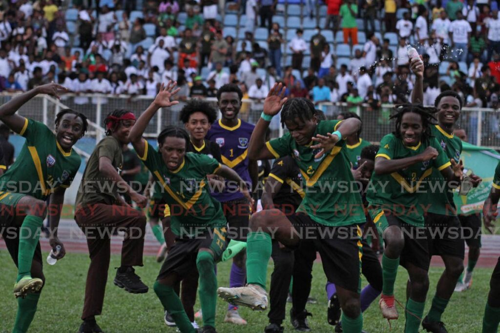 St Benedict’s players dance in celebration after beating Fatima College in the final of the Secondary Schools Football League premiership division on Wednesday at the Ato Boldon Stadium, Couva.  - Marvin Hamilton
