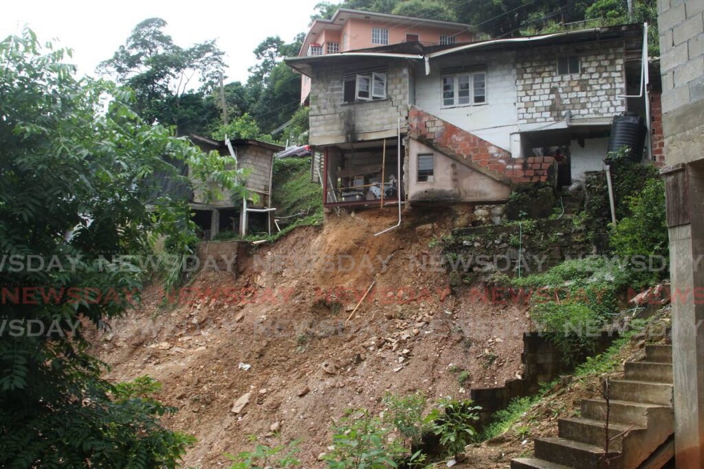 ON THE BRINK: One of several houses at Dibe Road, Long Circular Road, St James, which are under threat of collapse owing to landslides which occured on Wednesday. - ANGELO MARCELLE