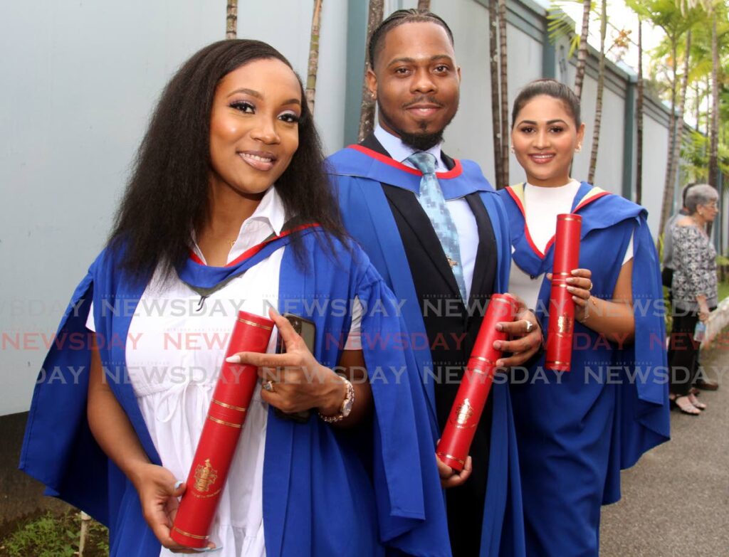 Kaia Smith, left, and Nicholai Lewis, graduates of the Faculty of Food and Agriculture, and Anastasia Mootoo who graduated from the Faculty of Science and Technology. Photo by Ayanna Kinsale