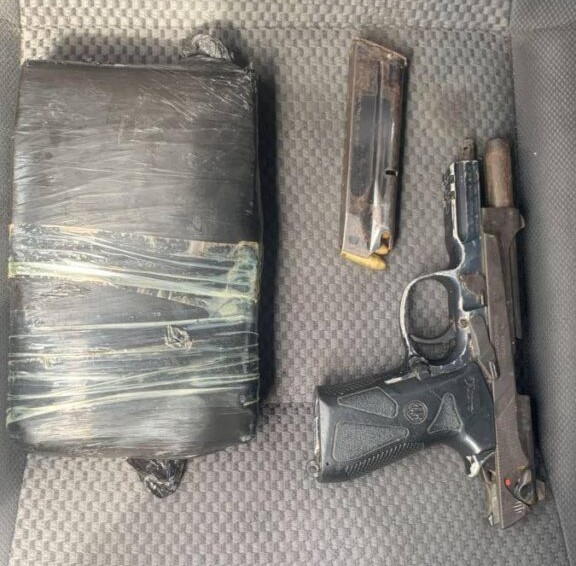 The gun and packet of cocaine found by police after a chase through El Socorro. A 28-year-old Barataria man was shot by police during the chase. Photo courtesy TTSP