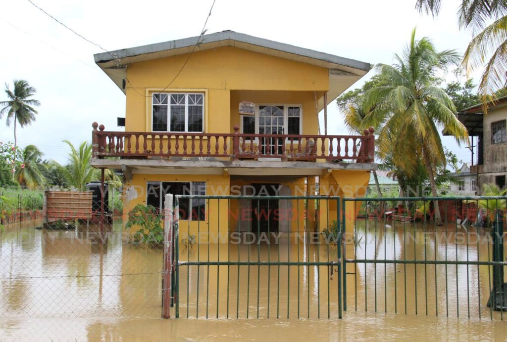 One of the houses at El Carmen, St Helena surrounded by floodwaters on Friday. Photo by Ayanna Kinsale