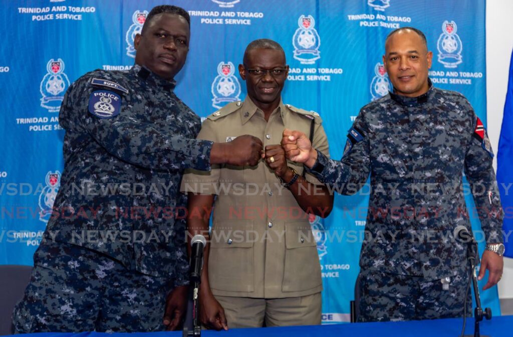Acting Snr Supt Earl Elie, head, guard and emergency branch, left, Tobago's Snr Supt Junior Benjamin, centre, and Snr Supt Oswain Subero of the Inter agency Task Force, at the Shirvan Police Station on Friday.  Photo by David Reid