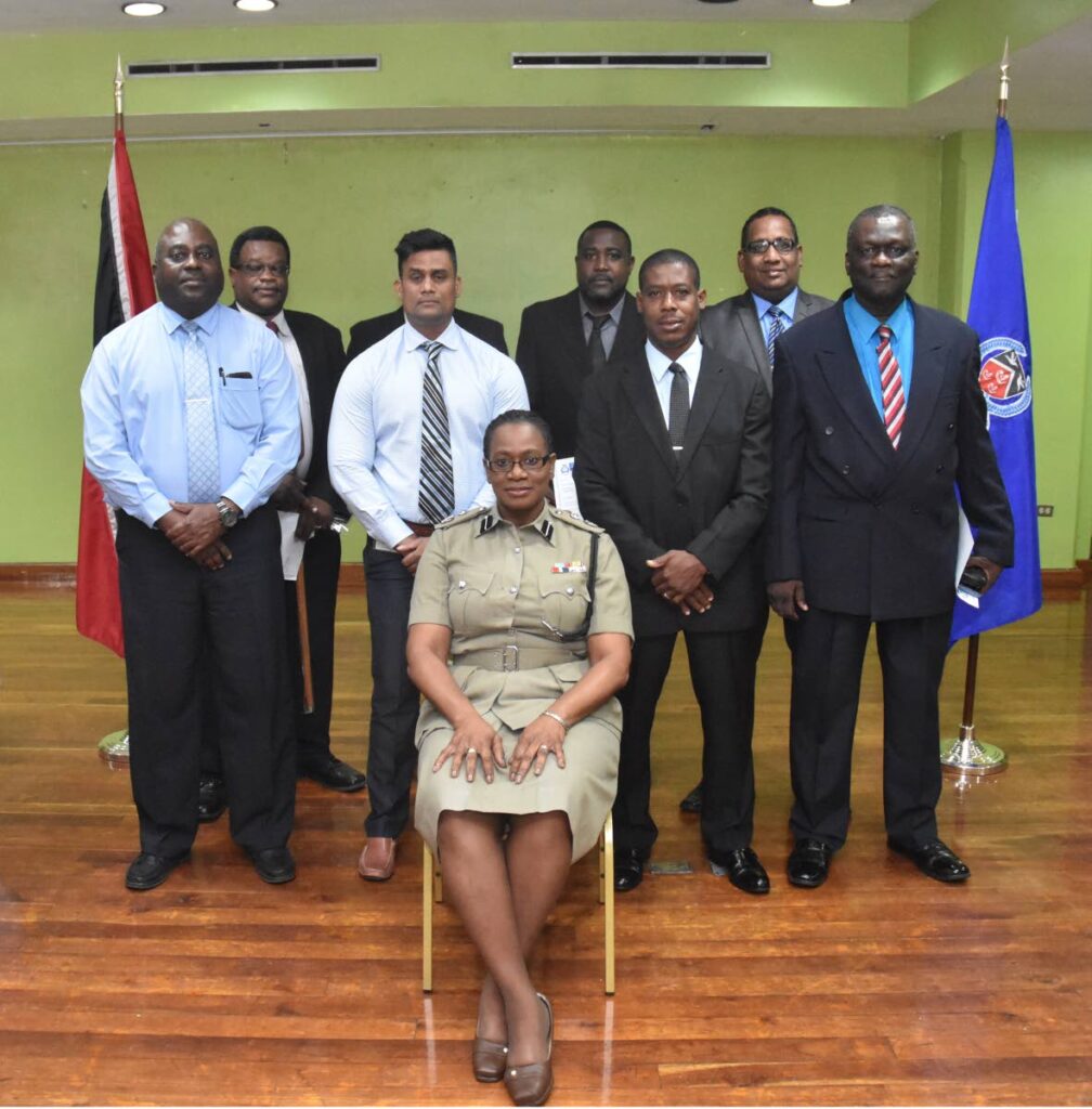 Acting Deputy Commissioner of Police Erla Christopher, seated, with the newly-promoted police officers in October 2018. File photo/TTPS - 