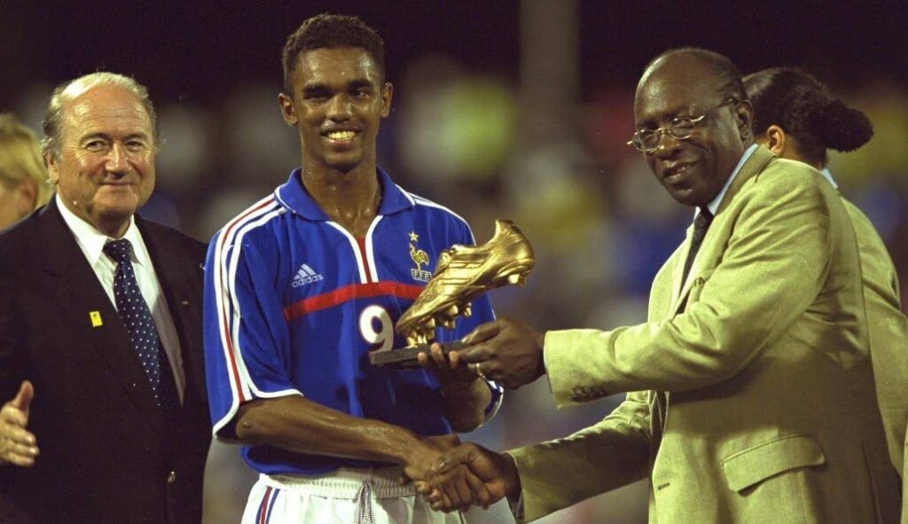 Former FIFA vice president Jack Warner, right, hands the MVP trophy to France's Florent Sinama-Pongolle, centre, at the 2001 FIFA U-17 World Championship in Trinidad. At left is ex-FIFA president Sepp Blatter.  - 