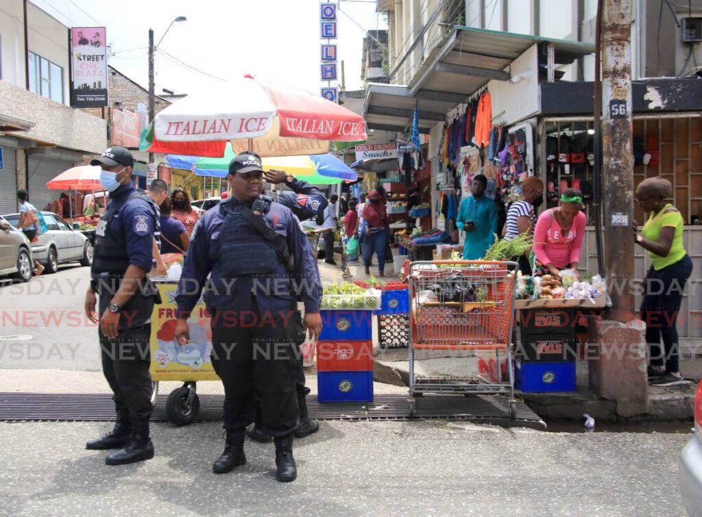 Policemen on patrol on Charlotte Street, Port of Spain.  - FILE PHOTO/SUREASH CHOLAI